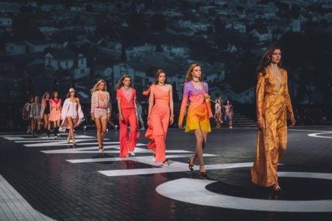 a runway finale image of models walking in the chanel cruise los angeles 2023
